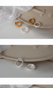 Detailed view of S925 sterling silver rings with irregular crushed texture finish