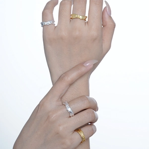 Minimalist S925 sterling silver rings with crumpled texture shown on hands in gold and silver