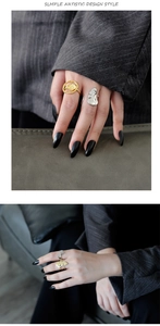 Artistic abstract face ring set in gold and silver finish on finger with hammered texture