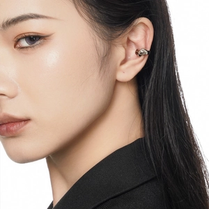 Minimalist S925 sterling silver knot ear cuff earring shown on model in silver finish