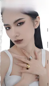 Detail of minimalist S925 sterling silver irregular liquid texture open ring on model