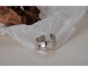 Macro shot of S925 sterling silver ring showing the inner stamp and irregular texture