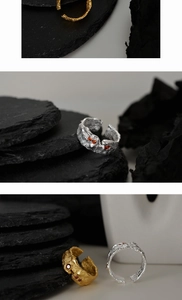 Detailed view of S925 sterling silver ring with molten lava texture and orange gems