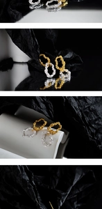 Macro shot of S925 sterling silver earrings with irregular gold and silver textures