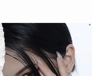 Close-up of fashion model with natural makeup highlighting luxury brand jewelry style