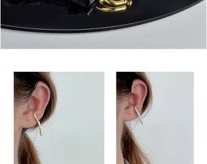 Detailed view of gold and silver irregular liquid-style ear cuffs with high polish finish