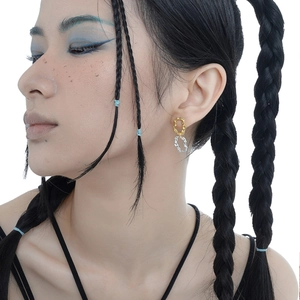 Minimalist S925 sterling silver two-tone irregular textured earrings worn by a model