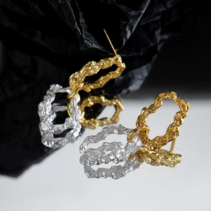 Minimalist S925 sterling silver stud earrings with two-tone lava texture and wavy design