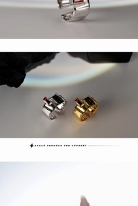 Detail of S925 silver adjustable rings with red zircon and wrinkled texture