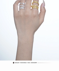 Detail showing lava texture S925 silver and gold-plated double-layer wavy open rings