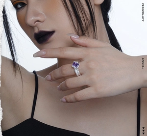 Detailed close-up of S925 silver ring featuring a large purple gemstone and lava texture