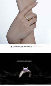 Detail of S925 silver rings with rock texture and rectangular gemstone inlay