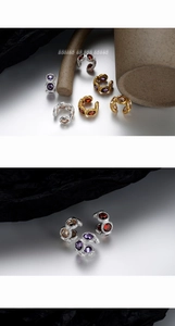Detailed view of textured S925 silver ear cuffs set with colorful zircon gemstones
