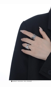 Detail of vintage S925 silver ring with irregular lava texture and black gemstone