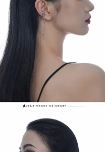 Silver fringe chain ear cuff on model showing tassel design and non-piercing style
