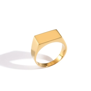 Macro shot of polished gold-plated square signet ring showing its smooth metal surface