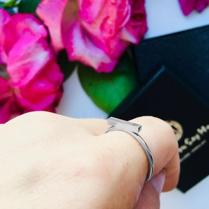 Polished silver stainless steel bar ring worn with pink roses and gift box packaging
