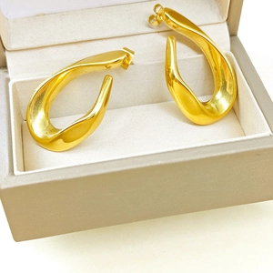 Boucles d'oreilles créoles torsadées irrégulières dorées en acier inoxydable géométrique