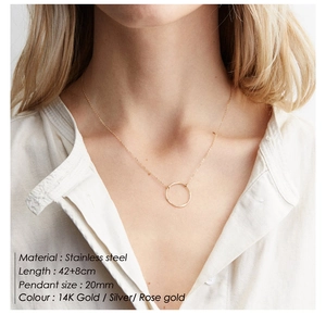 Detail showing 20mm stainless steel hammered circle pendant necklace on a model