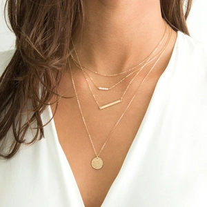 Minimalist four-layer gold stainless steel necklace set with pearls and round pendant
