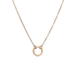 Detailed view of rose gold hollow circular pendant with textured finish on O-chain