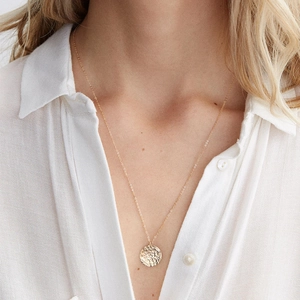 Minimalist gold stainless steel necklace with a handcrafted hammered round pendant