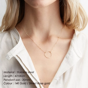 Minimalist stainless steel circular pendant necklace with hammer texture in gold finish