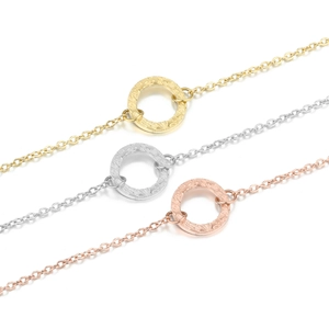 Minimalist hammered circle pendant necklaces in gold, silver, and rose gold finishes