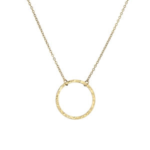 Minimalist gold necklace featuring a dainty chain and a unique hammered round pendant