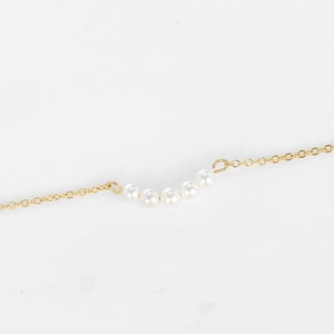 Minimalist layered stainless steel gold chain necklace with five round white pearls