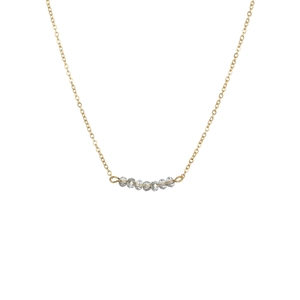 Collier minimaliste en acier inoxydable doré avec sept perles de cristal gris