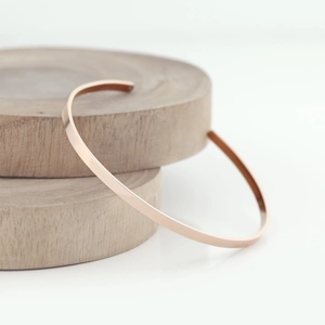 Minimalist rose gold titanium steel open bangle with a high polished finish