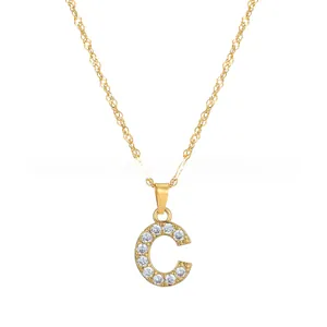 Detailed close-up of a gold-tone letter C pendant necklace set with clear cubic zirconia