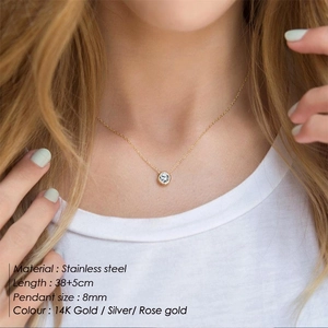 Classic stainless steel necklace with 8mm round zircon pendant worn on model neck