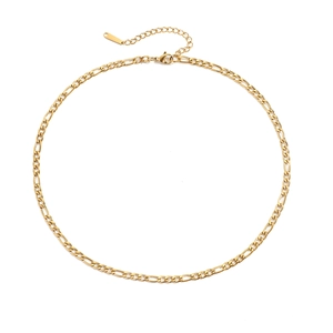 Detailed close-up of gold Figaro chain link with lobster clasp and extension chain