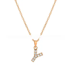 Detailed close-up of a gold-plated letter Y pendant with sparkling inlaid zircon stones
