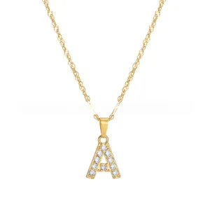 Close-up of golden letter A pendant necklace with sparkling white rhinestones inlay