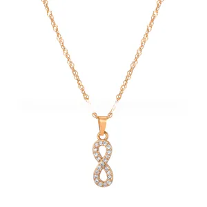Detailed view of infinity pendant necklace in gold finish with sparkling pavé zircons