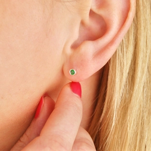 Minimalist silver stainless steel earring featuring a brilliant round green gemstone