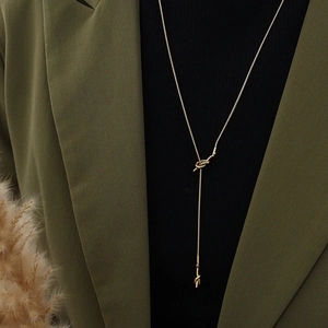 Minimalist gold Y-shaped knot snake chain necklace with elegant long fringe tassels