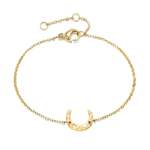 Detailed view of gold moon crescent bracelet with hammered texture and adjustable lobster clasp