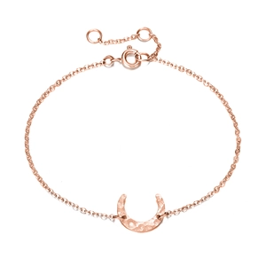 Detail of rose gold moon crescent pendant with hammered texture and adjustable chain clasp