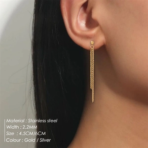 Detailed close-up of 2.2mm gold stainless steel tassel chain earrings on a model