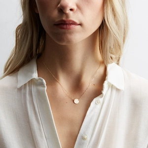 Minimalist double-layered stainless steel necklace with gold disc pendant and pearls