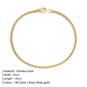 Macro detail of 2mm width 14K gold stainless steel box chain bracelet showing 19cm length