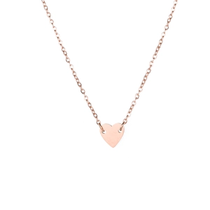 Detail shot of a rose gold heart pendant necklace featuring a polished minimalist finish
