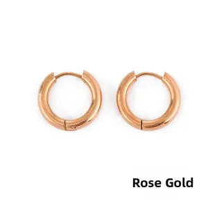 Close-up of rose gold stainless steel hoop earrings with a smooth polished finish