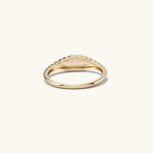 Detail of gold-plated croissant ring featuring a ribbed signet top and polished finish