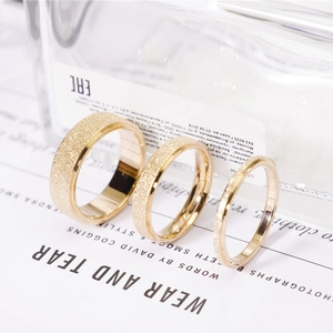Three-piece set of gold matte finish titanium steel rings with polished inner surface