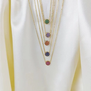 Luxurious round pendant necklaces in five colors with micro-paved crystals and gold plating